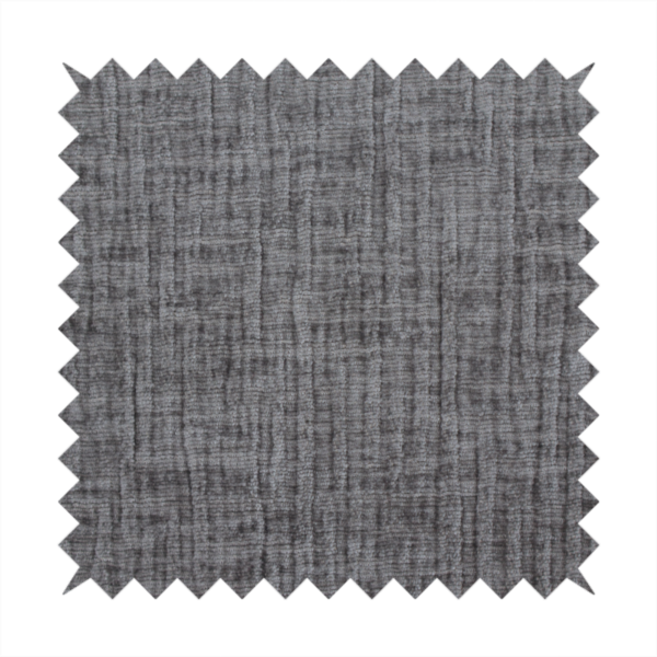 A textured upholstery fabric in a charcoal or dark grey shade. The material features a distinct cross-hatched slub texture with subtle vertical and horizontal ridges, creating a soft, dimensional chenille finish.