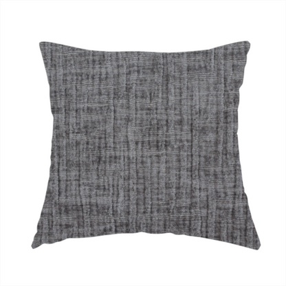 The fabric used to create this handmade cushion is a textured upholstery fabric in a charcoal or dark grey shade. The material features a distinct cross-hatched slub texture with subtle vertical and horizontal ridges, creating a soft, dimensional chenille finish.