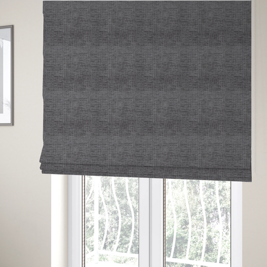 The fabric used to create these Roman blinds textured upholstery fabric in a charcoal or dark grey shade. The material features a distinct cross-hatched slub texture with subtle vertical and horizontal ridges, creating a soft, dimensional chenille finish.