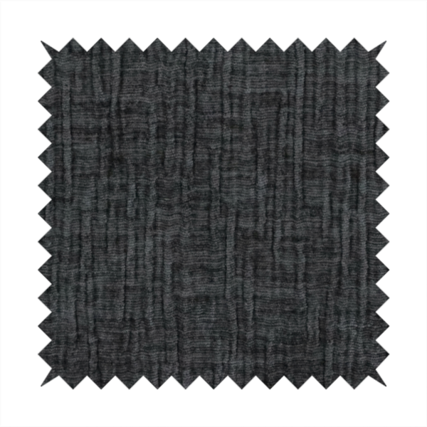 A textured upholstery fabric in a near-black or dark anthracite shade. The material features a distinct cross-hatched slub texture with prominent vertical and fine horizontal ridges, creating a soft, dimensional chenille finish.