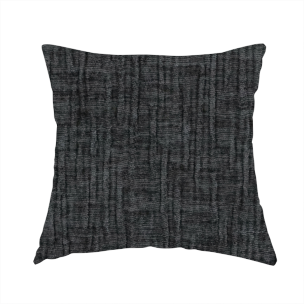 The fabric used to create this handmade cushion is a textured upholstery fabric in a near-black or dark anthracite shade. The material features a distinct cross-hatched slub texture with prominent vertical and fine horizontal ridges, creating a soft, dimensional chenille finish.