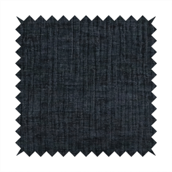 A textured upholstery fabric in a deep midnight black or very dark charcoal shade. The material features a distinct cross-hatched slub texture with subtle vertical and horizontal ridges, creating a soft, dimensional chenille finish.