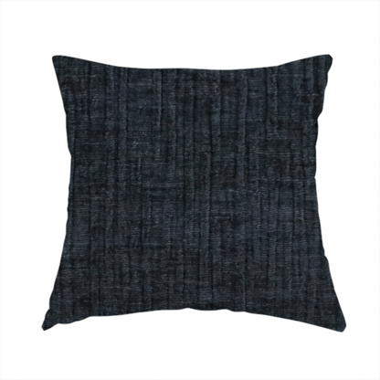 The fabric used to create this handmade cushion is a textured upholstery fabric in a deep midnight black or very dark charcoal shade. The material features a distinct cross-hatched slub texture with subtle vertical and horizontal ridges, creating a soft, dimensional chenille finish.