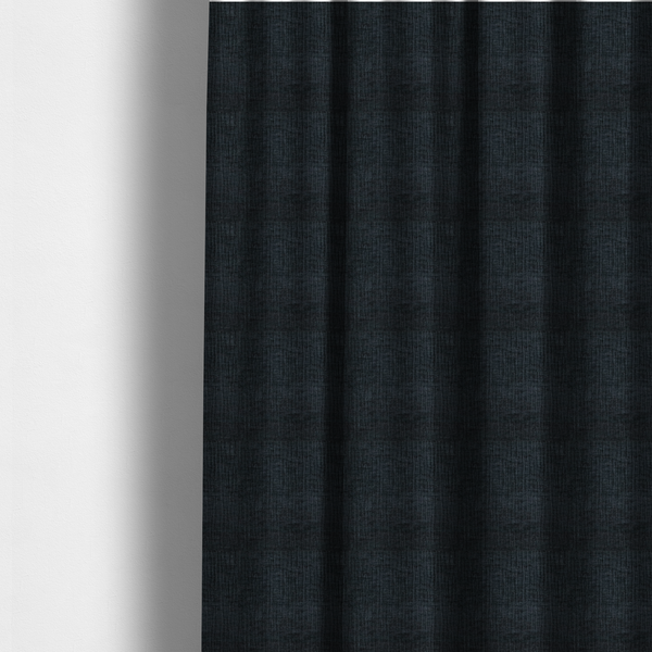 the fabric used to create these made-to-measure curtains is a textured upholstery fabric in a deep midnight black or very dark charcoal shade. The material features a distinct cross-hatched slub texture with subtle vertical and horizontal ridges, creating a soft, dimensional chenille finish.