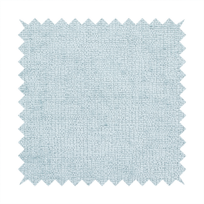 A textured fabric swatch in a soft, pale ice-blue colour. The material features a dense, uniform nubby weave or loop texture, resembling chenille, bouclé, or terry cloth, with subtle variations in shading that create a matte, soft appearance.
