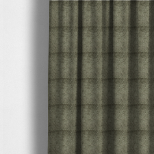 The fabric used to create these made-to-measure curtains is a textured fabric swatch in an earthy olive green or sage colour. The material features a dense, uniform nubby weave with subtle dark mottling throughout, giving the soft, textured surface a multi-tonal, organic appearance.