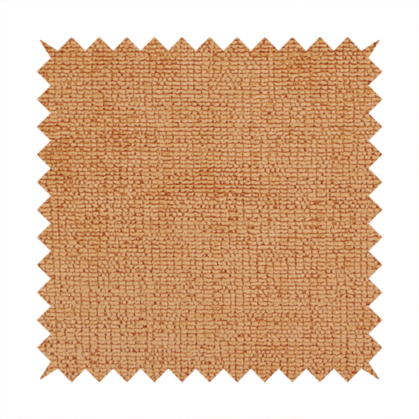 A textured fabric swatch in a warm terracotta or burnt orange colour. The material features a dense, uniform nubby weave with a soft, matte appearance, resembling chenille or bouclé cloth.