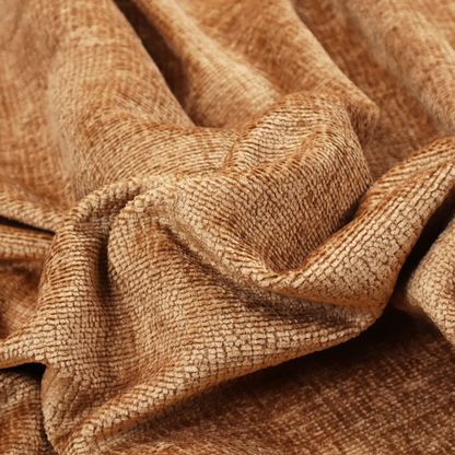 A textured fabric swatch in a warm terracotta or burnt orange colour. The material features a dense, uniform nubby weave with a soft, matte appearance, resembling chenille or bouclé cloth.