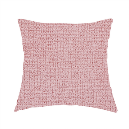 The fabric used to create this handmade cushion is a textured fabric swatch in a soft, dusty pink or rose colour. The material features a dense, uniform nubby weave with a matte finish, creating a gentle and welcoming appearance.