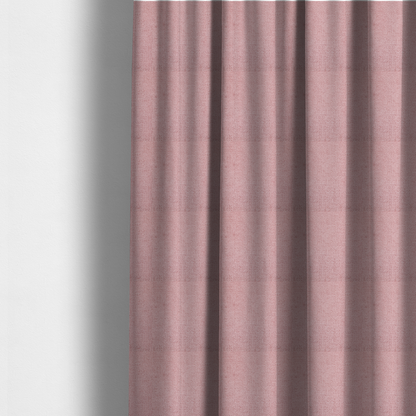 The fabric used to create these made-to-measure curtains is a textured fabric swatch in a soft, dusty pink or rose colour. The material features a dense, uniform nubby weave with a matte finish, creating a gentle and welcoming appearance.
