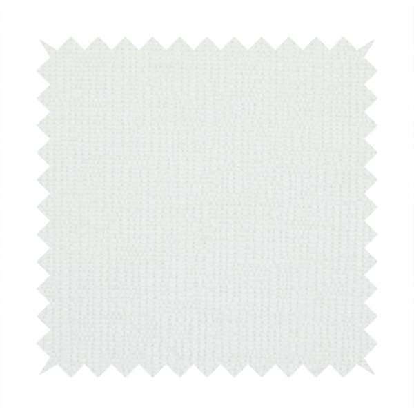 A textured fabric swatch in a crisp, clean white or off-white colour. The material features a dense, uniform nubby weave with a soft, matte finish, creating a bright and minimalist appearance.