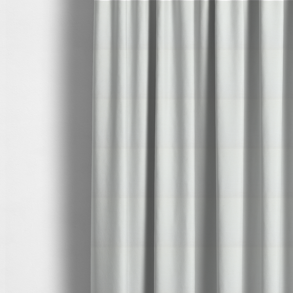 The fabric used to create these made-to-measure curtains is a textured fabric swatch in a crisp, clean white or off-white colour. The material features a dense, uniform nubby weave with a soft, matte finish, creating a bright and minimalist appearance.