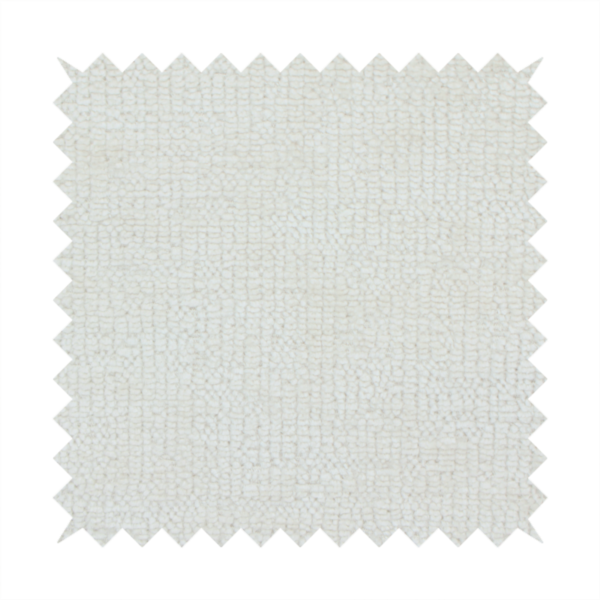A textured fabric swatch in a soft cream, ivory, or natural off-white colour. The material features a dense, uniform nubby weave with subtle warm undertones, creating a cosy and clean appearance.