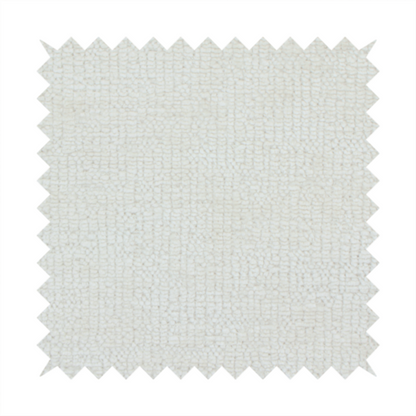 A textured fabric swatch in a soft cream, ivory, or natural off-white colour. The material features a dense, uniform nubby weave with subtle warm undertones, creating a cosy and clean appearance.