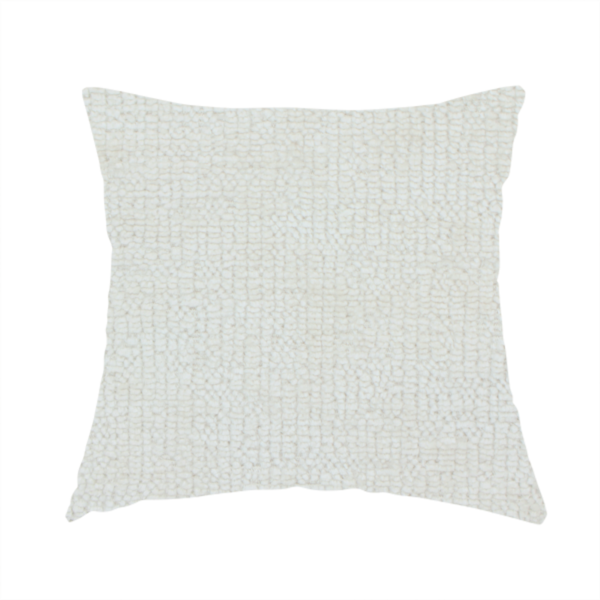 The fabric used to create this handmade cushion is a textured fabric swatch in a soft cream, ivory, or natural off-white colour. The material features a dense, uniform nubby weave with subtle warm undertones, creating a cosy and clean appearance.