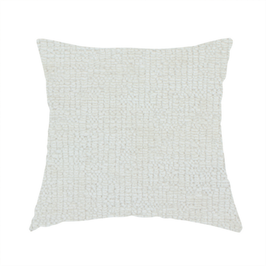 The fabric used to create this handmade cushion is a textured fabric swatch in a soft cream, ivory, or natural off-white colour. The material features a dense, uniform nubby weave with subtle warm undertones, creating a cosy and clean appearance.