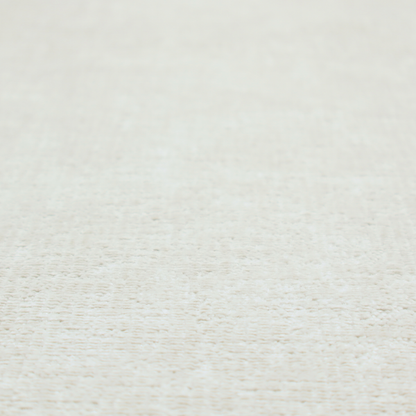A textured fabric swatch in a soft cream, ivory, or natural off-white colour. The material features a dense, uniform nubby weave with subtle warm undertones, creating a cosy and clean appearance.