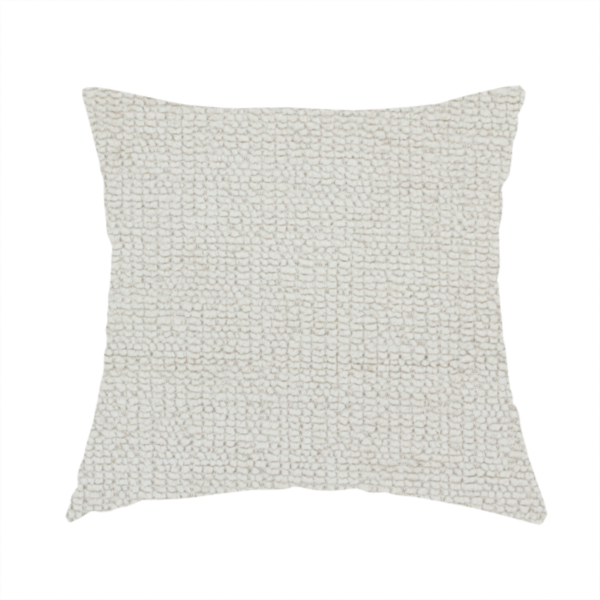the fabric used to create this handmade cushion is a textured fabric swatch in a very pale, light beige or ecru colour. The material features a dense, uniform nubby weave with subtle neutral undertones, creating a soft, warm-toned minimalist appearance.
