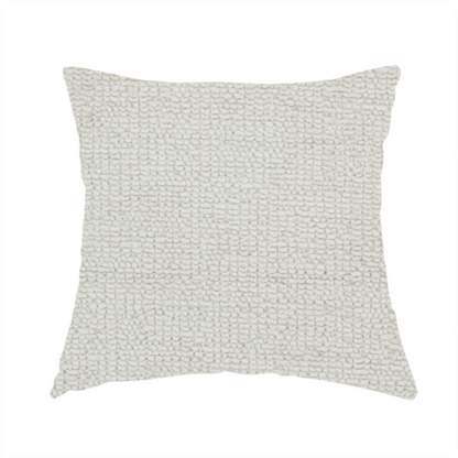 the fabric used to create this handmade cushion is a textured fabric swatch in a very pale, light beige or ecru colour. The material features a dense, uniform nubby weave with subtle neutral undertones, creating a soft, warm-toned minimalist appearance.