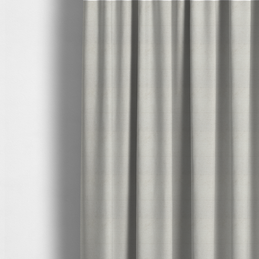 The fabric used to create these made-to-measure curtains is a textured fabric swatch in a very pale, light beige or ecru colour. The material features a dense, uniform nubby weave with subtle neutral undertones, creating a soft, warm-toned minimalist appearance.