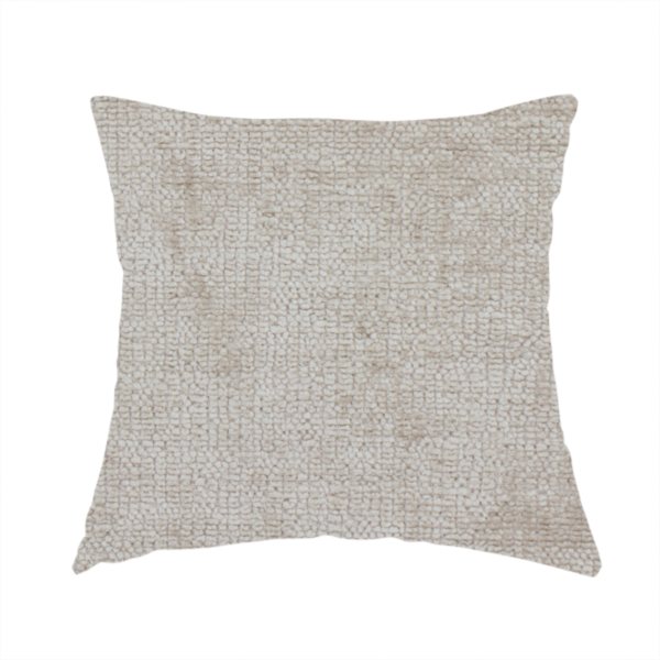 The fabric used to create this handmade cushion is a textured fabric swatch in a light, neutral taupe or sandy beige colour. The material features a dense, uniform nubby weave with subtle horizontal striations and warm grey undertones, creating a soft, multi-tonal appearance.