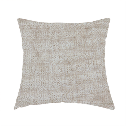 The fabric used to create this handmade cushion is a textured fabric swatch in a light, neutral taupe or sandy beige colour. The material features a dense, uniform nubby weave with subtle horizontal striations and warm grey undertones, creating a soft, multi-tonal appearance.