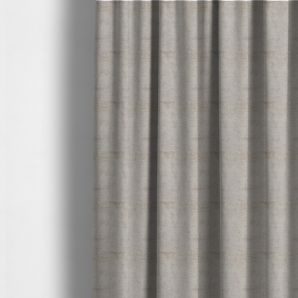 The fabric used to create these made-to-measure curtains is a textured fabric swatch in a light, neutral taupe or sandy beige colour. The material features a dense, uniform nubby weave with subtle horizontal striations and warm grey undertones, creating a soft, multi-tonal appearance.