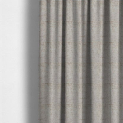 The fabric used to create these made-to-measure curtains is a textured fabric swatch in a light, neutral taupe or sandy beige colour. The material features a dense, uniform nubby weave with subtle horizontal striations and warm grey undertones, creating a soft, multi-tonal appearance.