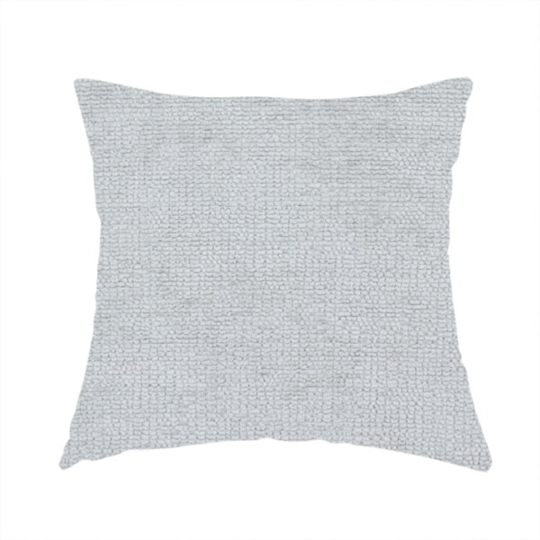 The fabric used to create this handmade cushion is a textured fabric swatch in a very pale, light grey or silver colour. The material features a dense, uniform nubby weave with subtle neutral undertones, creating a soft, clean, and modern appearance.