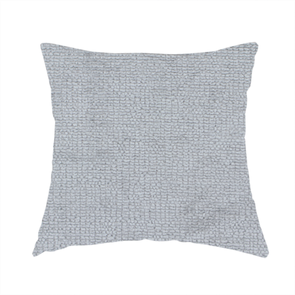 The fabric used to create this handmade cushion is a textured fabric swatch in a cool, light-to-medium grey or stone colour. The material features a dense, uniform nubby weave with subtle horizontal shadowing, creating a soft, contemporary matte finish.