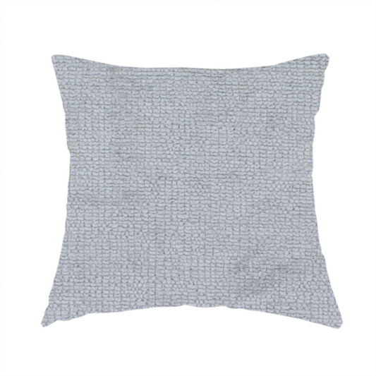 The fabric used to create this handmade cushion is a textured fabric swatch in a cool, light-to-medium grey or stone colour. The material features a dense, uniform nubby weave with subtle horizontal shadowing, creating a soft, contemporary matte finish.