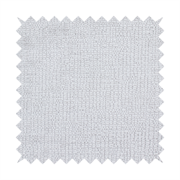 A textured fabric swatch in a very light, icy grey or pale ash colour. The material features a dense, uniform nubby weave with bright neutral tones, creating a clean, crisp, and contemporary appearance.