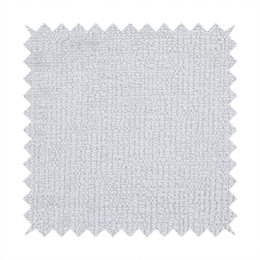 A textured fabric swatch in a very light, icy grey or pale ash colour. The material features a dense, uniform nubby weave with bright neutral tones, creating a clean, crisp, and contemporary appearance.