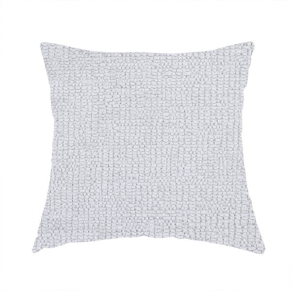 The fabric used to create this handmade cushion is a textured fabric swatch in a very light, icy grey or pale ash colour. The material features a dense, uniform nubby weave with bright neutral tones, creating a clean, crisp, and contemporary appearance.