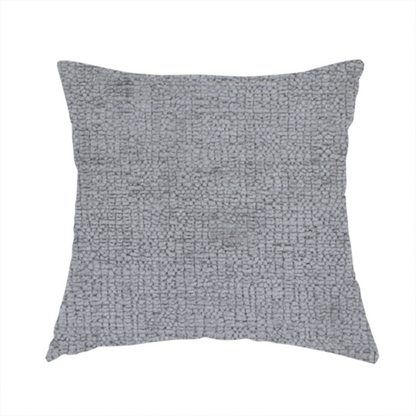 The fabric used to create this handmade cushion is a textured fabric swatch in a medium grey or slate colour. The material features a dense, uniform nubby weave with subtle dark and light shading variations, creating a soft, multi-tonal contemporary look.