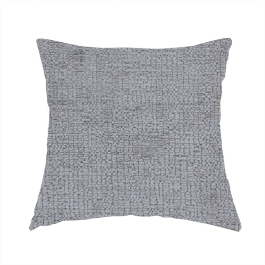 The fabric used to create this handmade cushion is a textured fabric swatch in a medium grey or slate colour. The material features a dense, uniform nubby weave with subtle dark and light shading variations, creating a soft, multi-tonal contemporary look.
