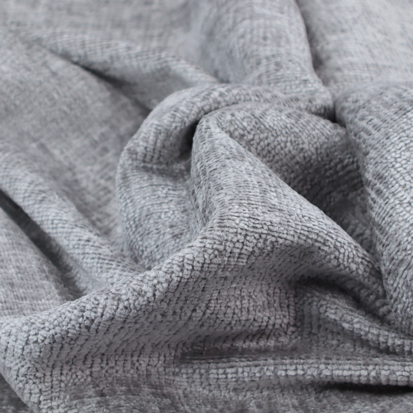 A textured fabric swatch in a medium grey or slate colour. The material features a dense, uniform nubby weave with subtle dark and light shading variations, creating a soft, multi-tonal contemporary look.