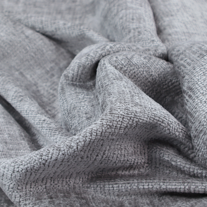 A textured fabric swatch in a medium grey or slate colour. The material features a dense, uniform nubby weave with subtle dark and light shading variations, creating a soft, multi-tonal contemporary look.