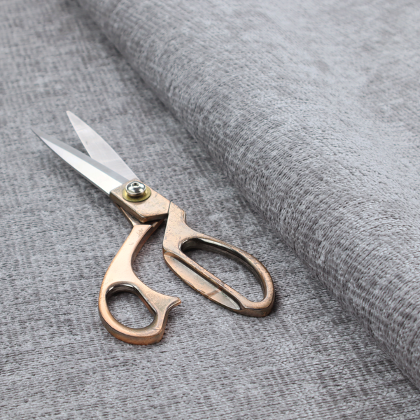 A textured fabric swatch in a medium grey or slate colour. The material features a dense, uniform nubby weave with subtle dark and light shading variations, creating a soft, multi-tonal contemporary look.