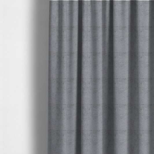 The fabric used to create these made-to-measure curtains is a textured fabric swatch in a medium grey or slate colour. The material features a dense, uniform nubby weave with subtle dark and light shading variations, creating a soft, multi-tonal contemporary look.