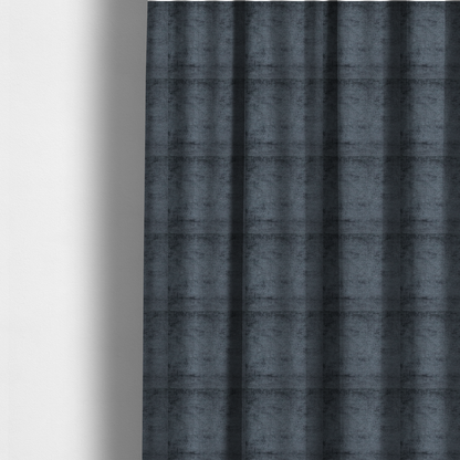The fabric used to create these made-to-measure curtains is a textured fabric swatch in a dark charcoal or graphite grey colour. The material features a dense, uniform nubby weave with deep, moody undertones and subtle dark shadowing, creating a rich, contemporary appearance.