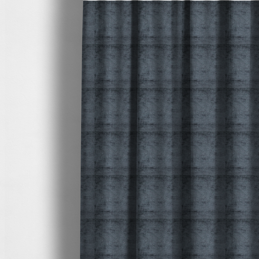 The fabric used to create these made-to-measure curtains is a textured fabric swatch in a dark charcoal or graphite grey colour. The material features a dense, uniform nubby weave with deep, moody undertones and subtle dark shadowing, creating a rich, contemporary appearance.