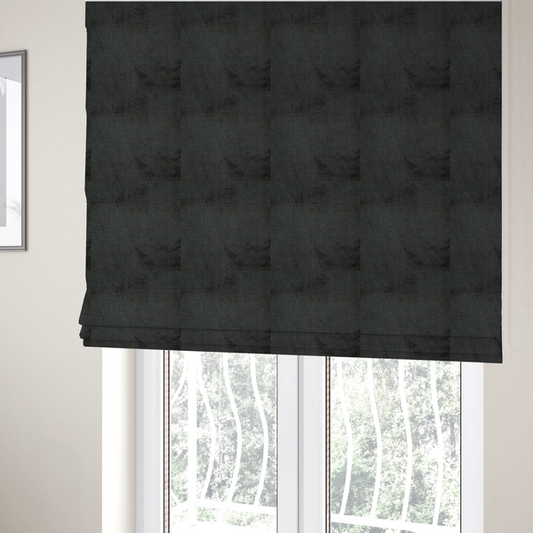 The fabric used to create these Roman blinds is a textured fabric swatch in a very dark anthracite or charcoal grey colour. The material features a dense, uniform nubby weave with deep, almost black shading variations, creating a rich, moody, and sophisticated appearance.