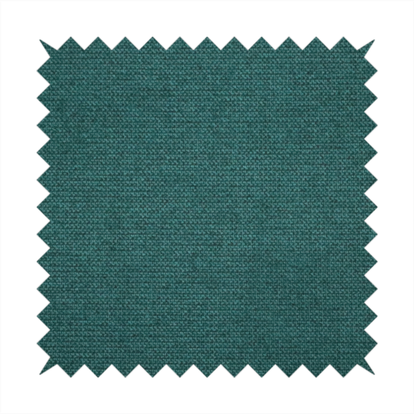 A textured teal fabric with a visible tight weave.