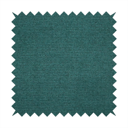 A textured teal fabric with a visible tight weave.