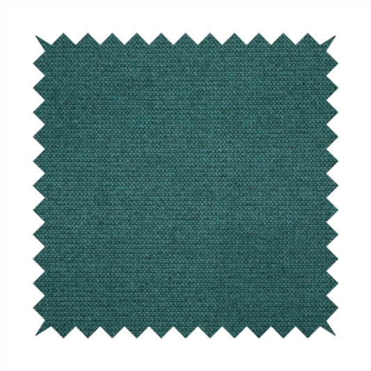 A textured teal fabric with a visible tight weave.