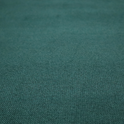 A textured teal fabric with a visible tight weave.
