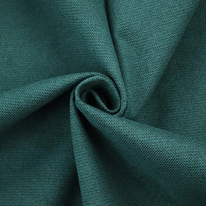 A textured teal fabric with a visible tight weave.