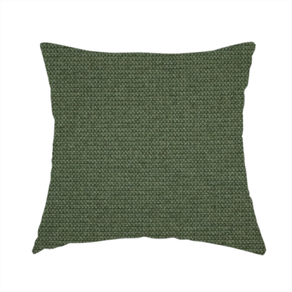The fabric used to create this handmade cushion is a textured moss green fabric with a tight, uniform weave.