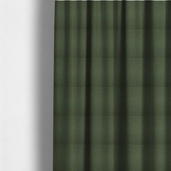 The fabric used to create these made-to-measure curtains is a textured moss green fabric with a tight, uniform weave.